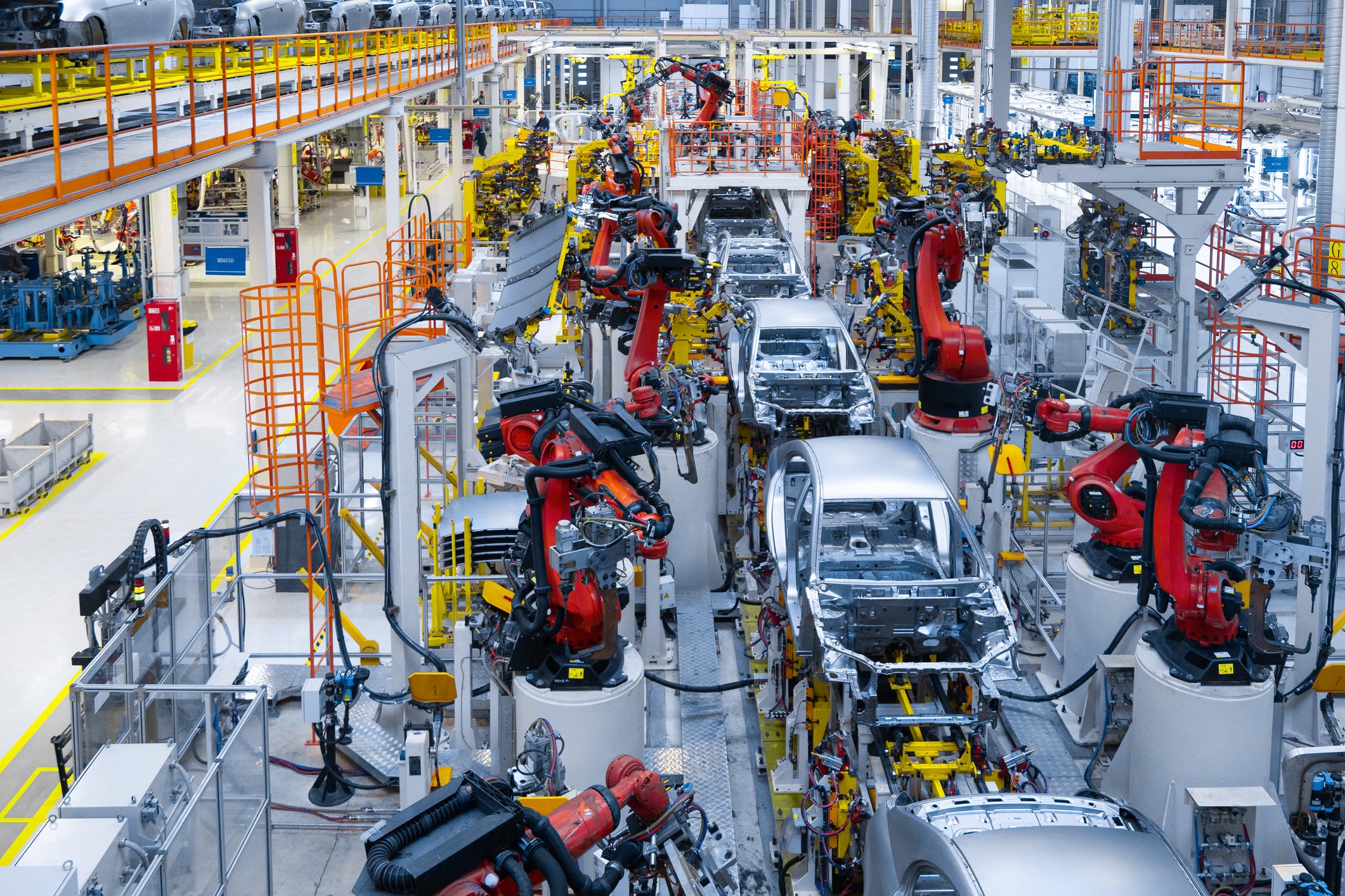 Assembly line production of new car. Automated welding of car body on production line. robotic arm on car production line is working